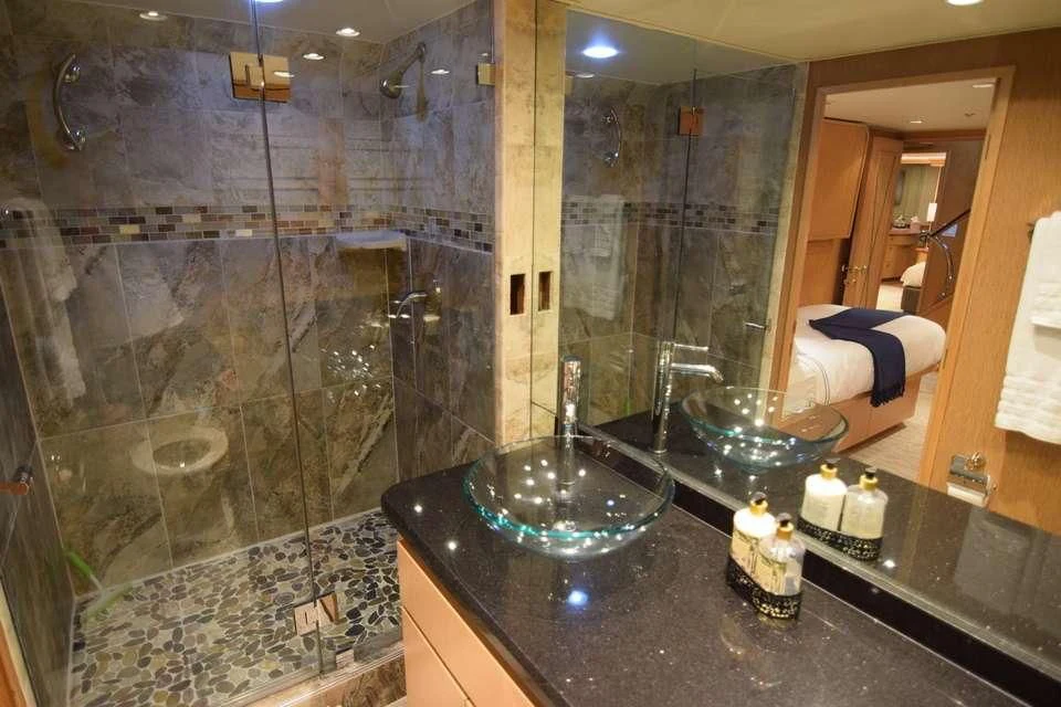 a bathroom with a large glass shower aboard ISLAND VIBE Yacht for Sale