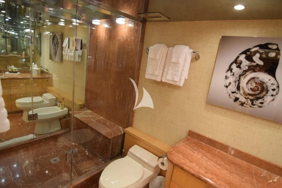a bathroom with a glass shower aboard ISLAND VIBE Yacht for Sale
