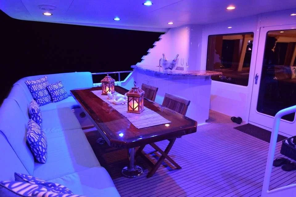 a living room with a fireplace aboard ISLAND VIBE Yacht for Sale