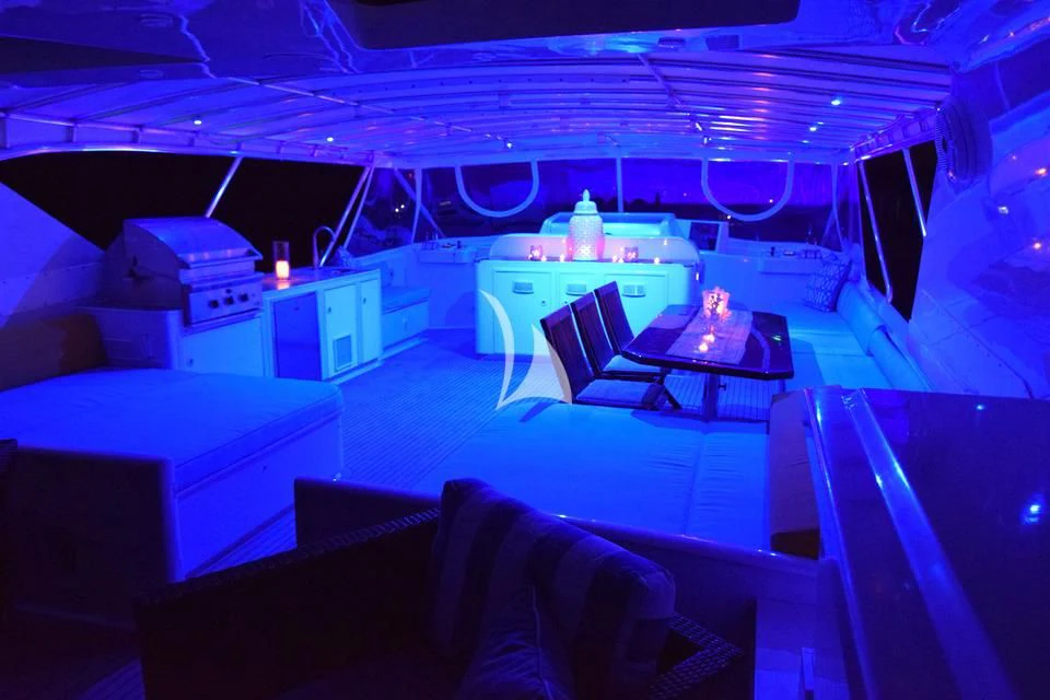 a room with a table and chairs aboard ISLAND VIBE Yacht for Sale