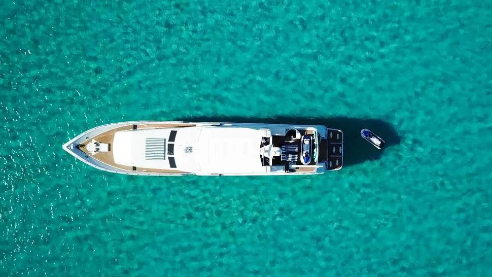 a black and white object on a green surface aboard ISLAND VIBE Yacht for Sale