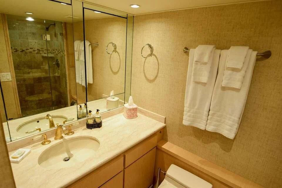 a bathroom with a large mirror aboard ISLAND VIBE Yacht for Sale