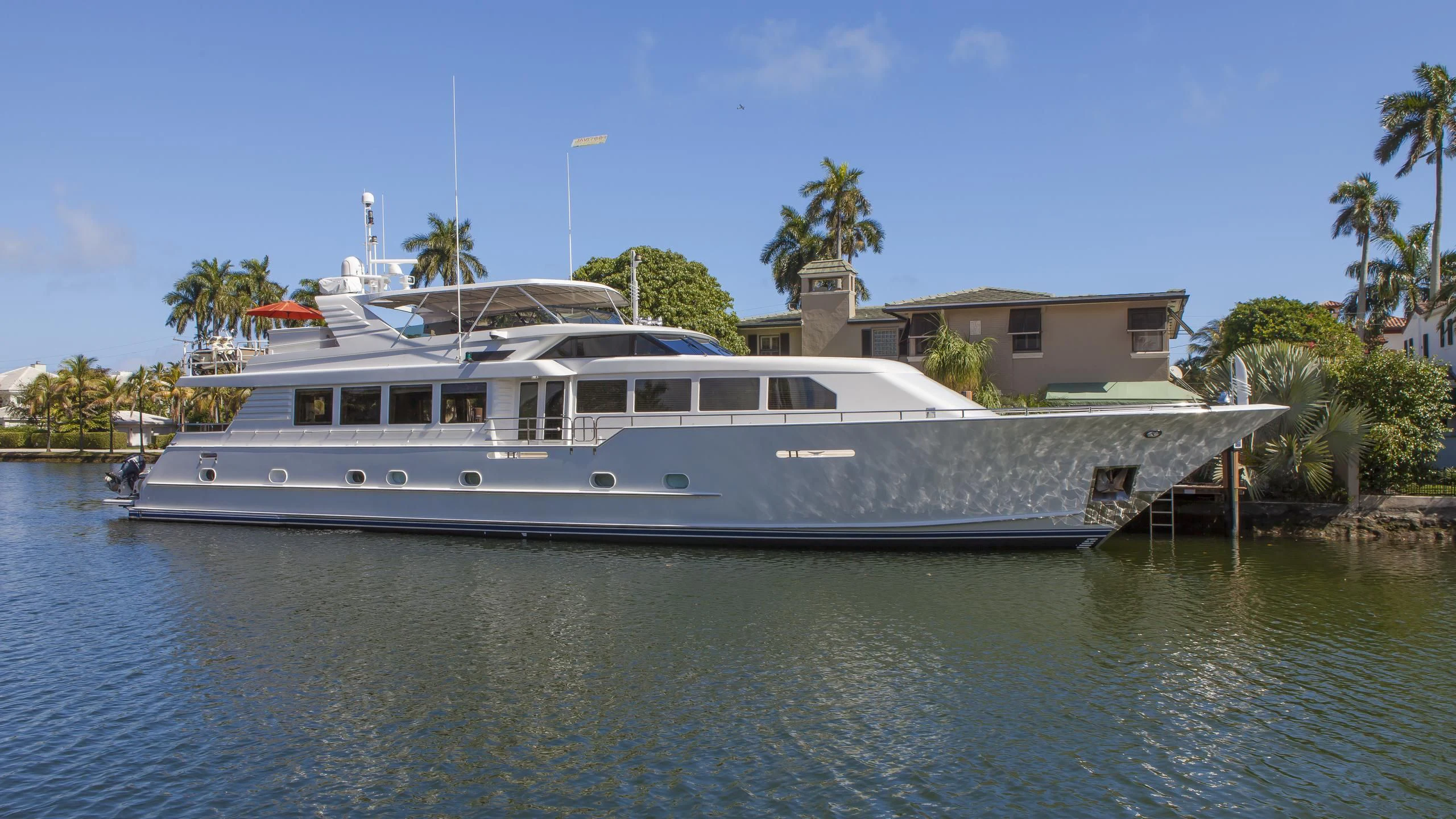 a large white boat in the water aboard ISLAND VIBE Yacht for Sale