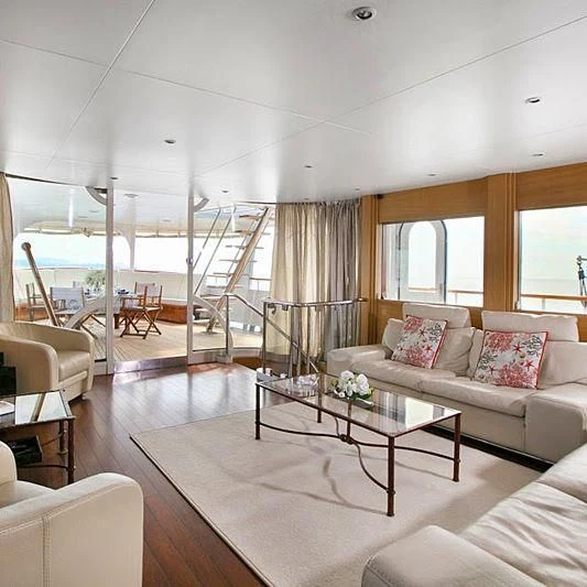 a living room with a glass door aboard LADY JERSEY Yacht for Charter