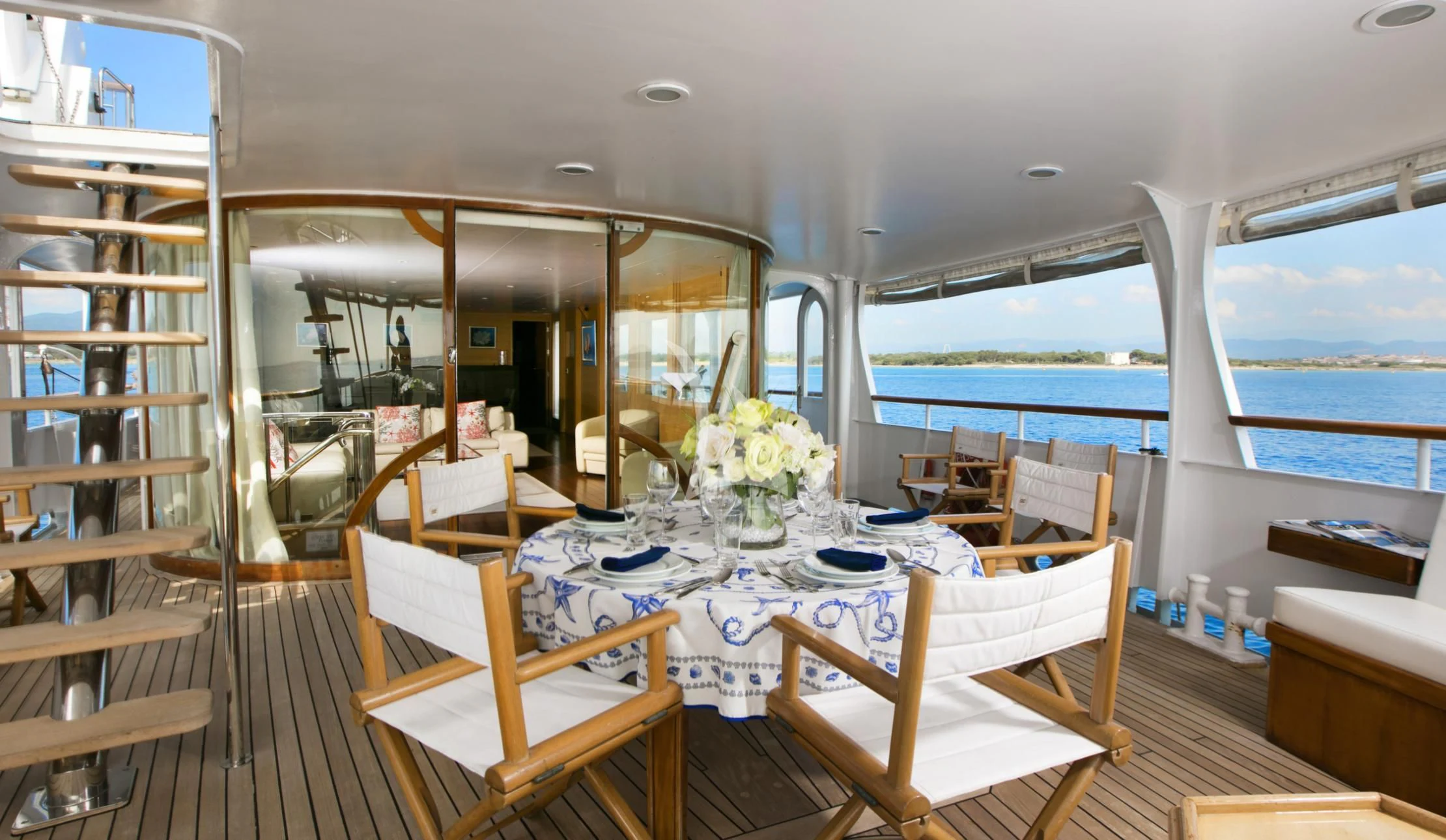 a room with a table and chairs aboard LADY JERSEY Yacht for Charter