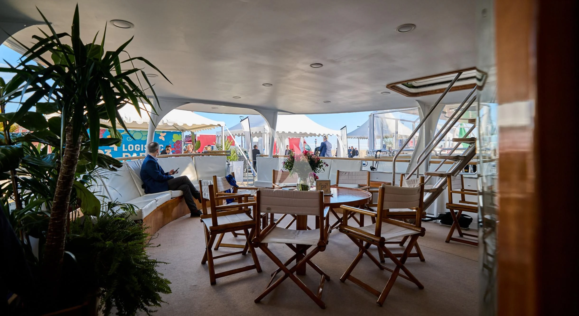 a room with tables and chairs aboard LADY JERSEY Yacht for Charter