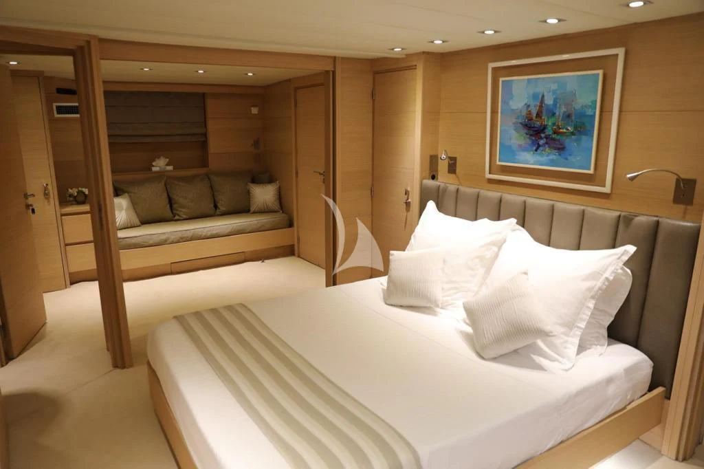 a hotel room with a bed and a couch aboard LADY JERSEY Yacht for Charter