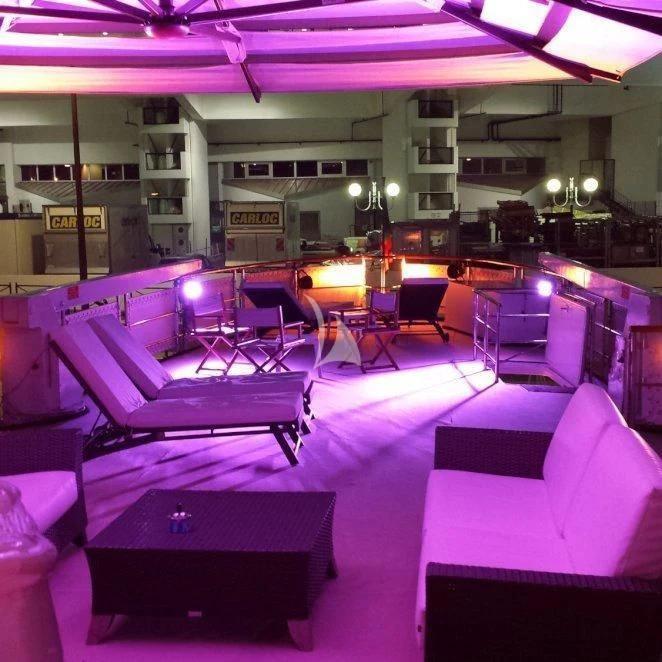 a room with a row of seats aboard LADY JERSEY Yacht for Charter