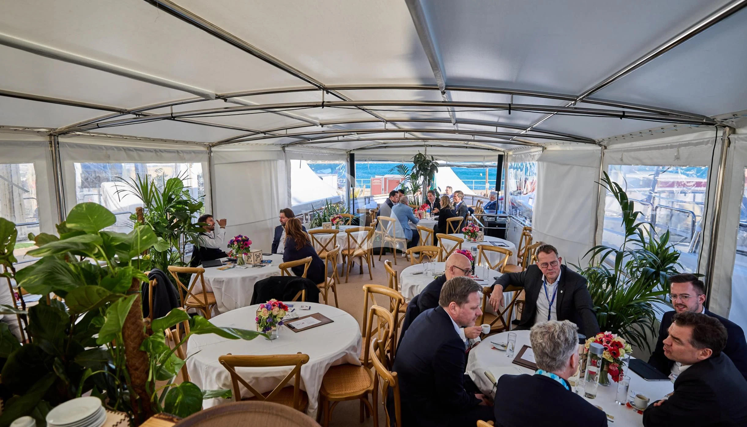a group of people sitting at tables aboard LADY JERSEY Yacht for Charter