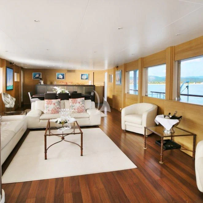 a living room with a large window aboard LADY JERSEY Yacht for Charter