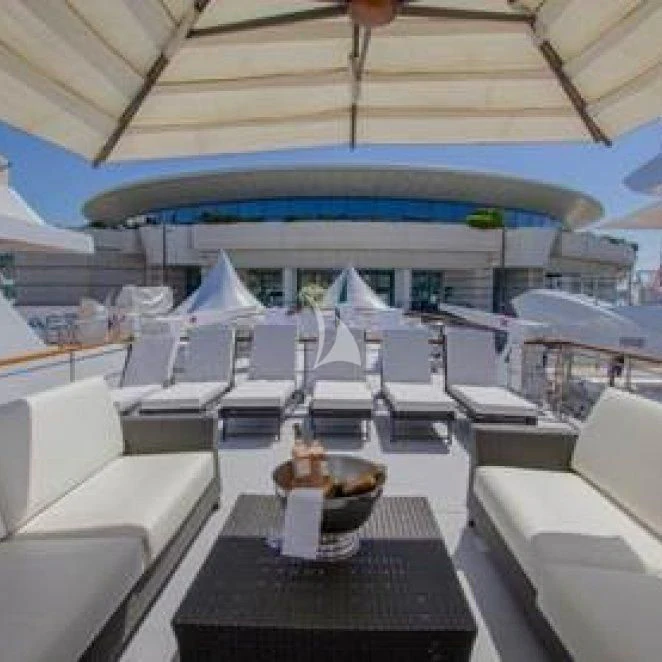 a large room with chairs and tables aboard LADY JERSEY Yacht for Charter