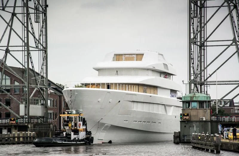 a large white ship docked aboard LONIAN Yacht for Sale
