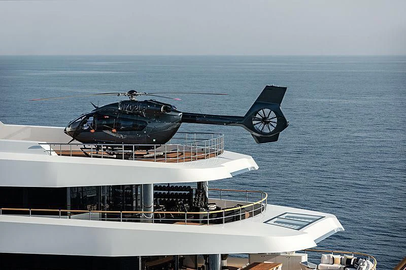 a helicopter flying over a boat aboard LONIAN Yacht for Sale