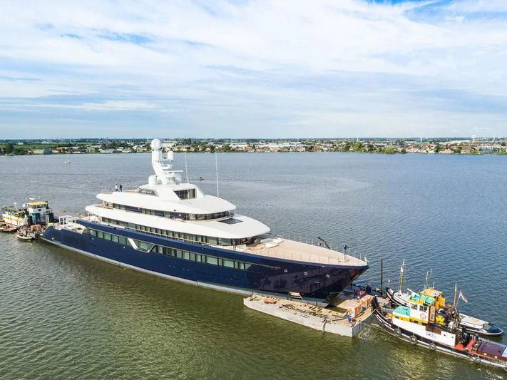 a large ship docked at a port aboard LONIAN Yacht for Sale