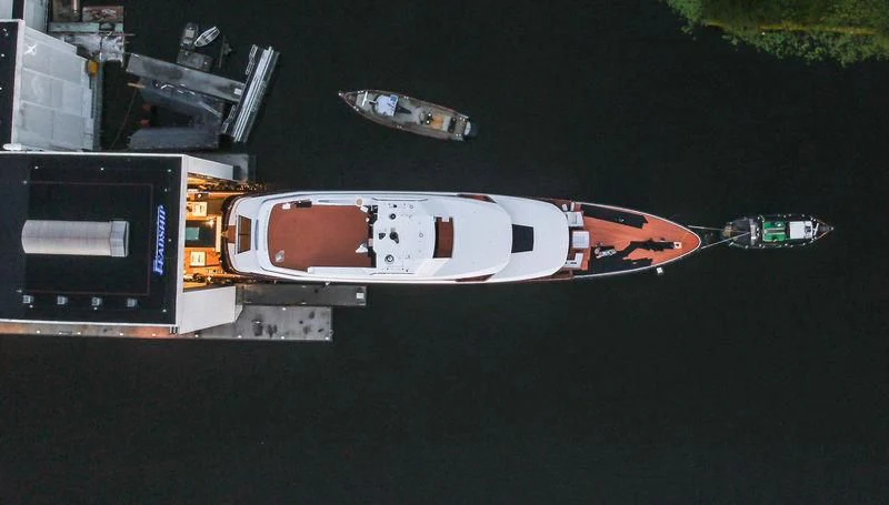 a couple of cars parked on a road at night aboard LONIAN Yacht for Sale