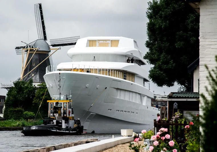 a large white ship docked aboard LONIAN Yacht for Sale