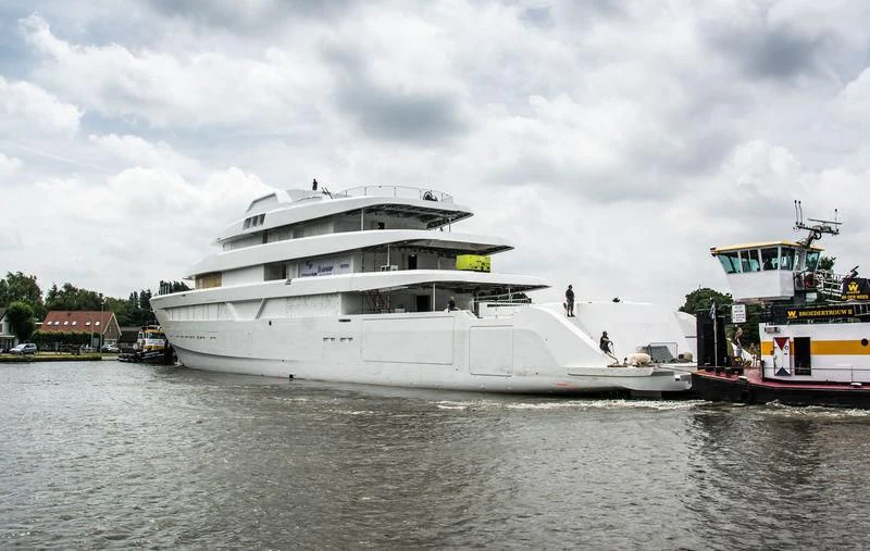 a large white boat with a boat on it aboard LONIAN Yacht for Sale