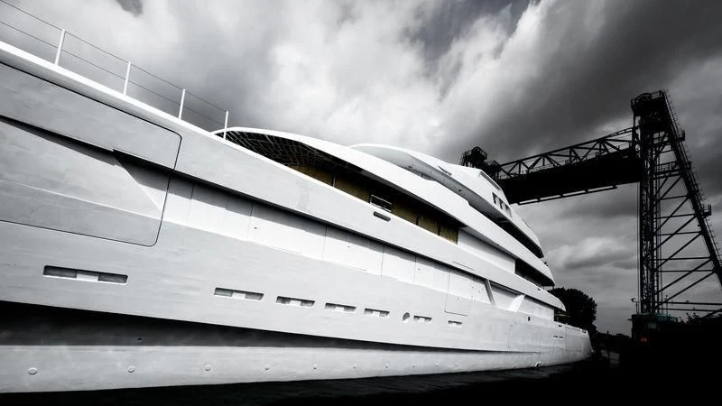 a large yacht in front of a large crane aboard LONIAN Yacht for Sale