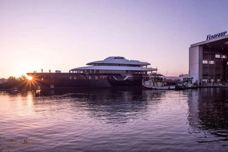 a large cruise ship docked at a pier aboard LONIAN Yacht for Sale