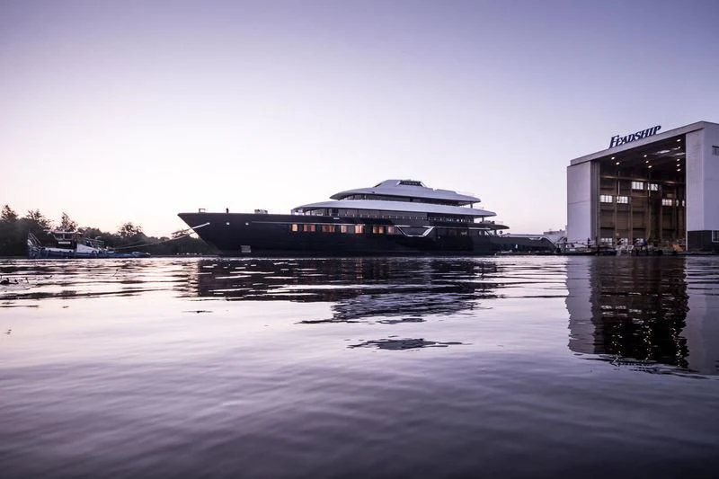 a large building next to a body of water aboard LONIAN Yacht for Sale