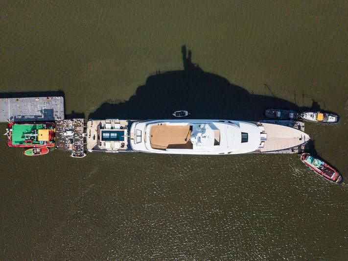 a group of buildings with a hill in the background aboard LONIAN Yacht for Sale