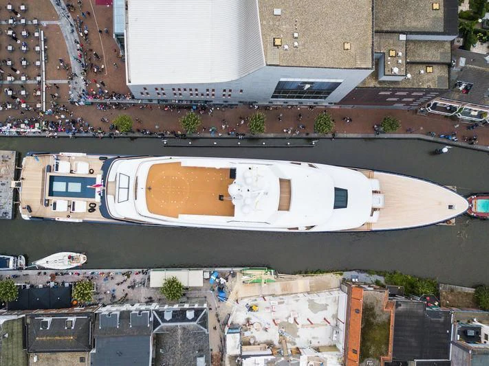 a large building with a parking lot aboard LONIAN Yacht for Sale