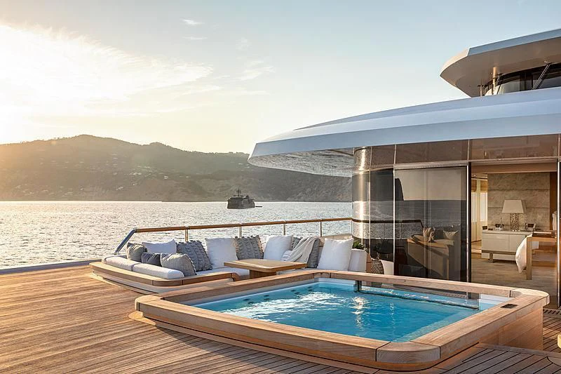 a large swimming pool on a deck aboard LONIAN Yacht for Sale
