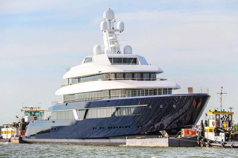 a large cruise ship docked aboard LONIAN Yacht for Sale
