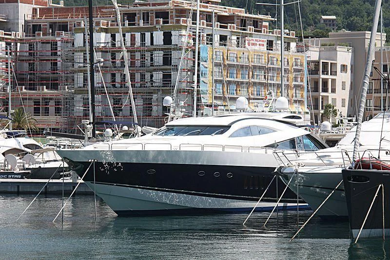 a boat docked in a harbor aboard CASINO ROYALE Yacht for Sale