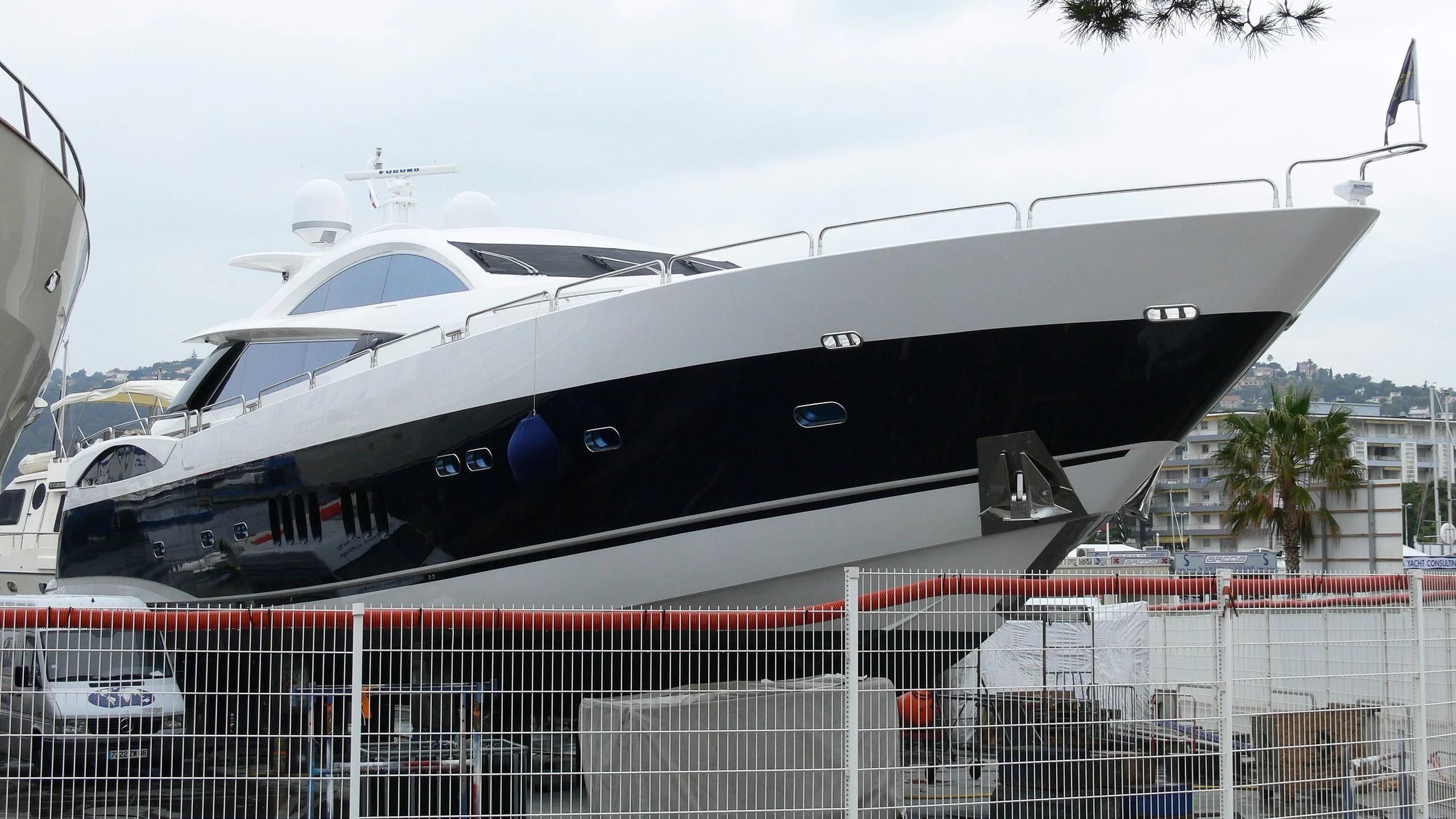 a white yacht in a fenced in area aboard CASINO ROYALE Yacht for Sale