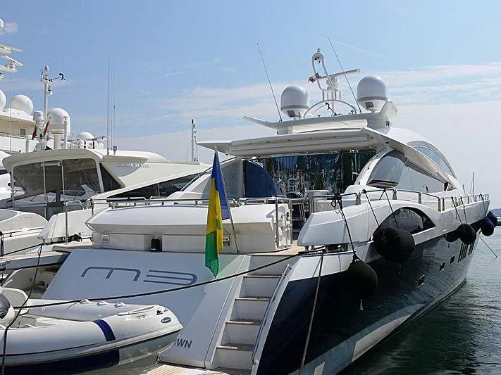 a boat docked at a pier aboard CASINO ROYALE Yacht for Sale