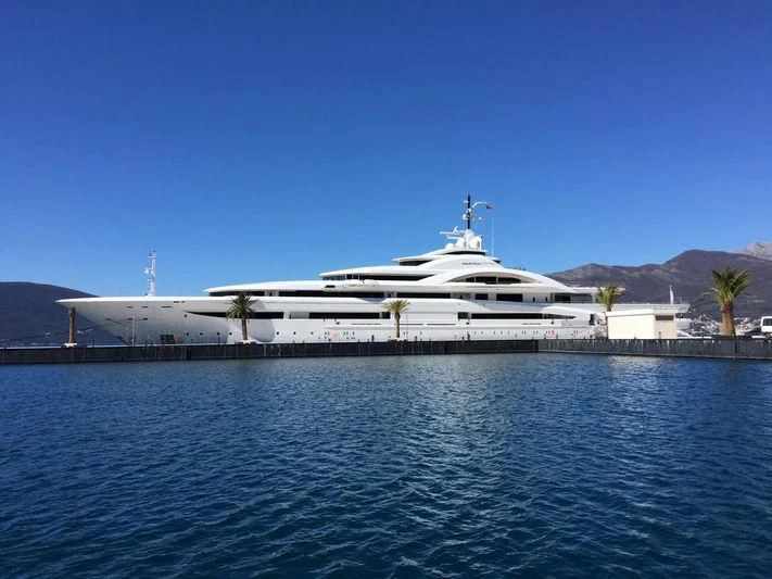 a white boat on a dock aboard MARYAH Yacht for Sale