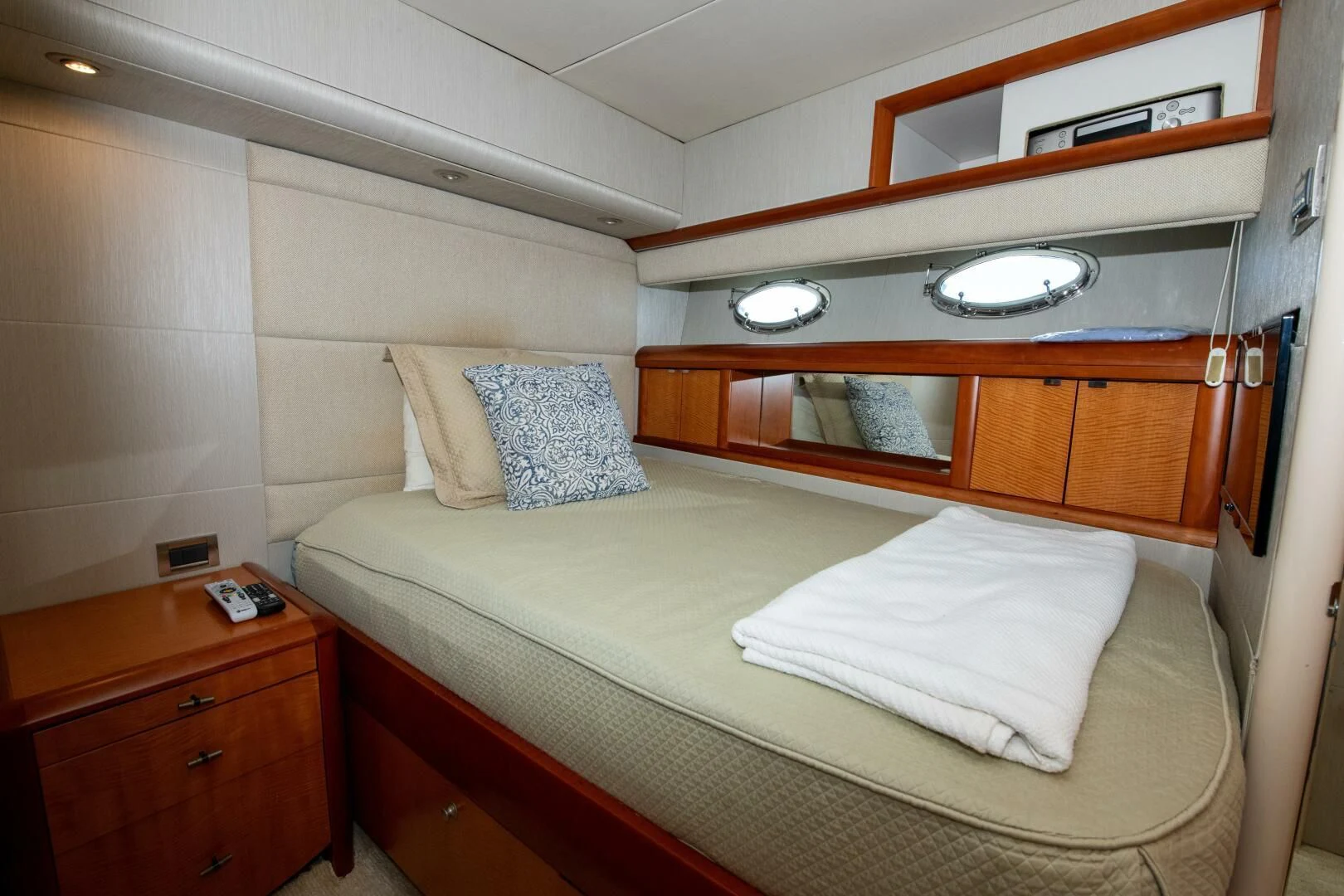 a bed with white sheets aboard STARFIRE Yacht for Sale