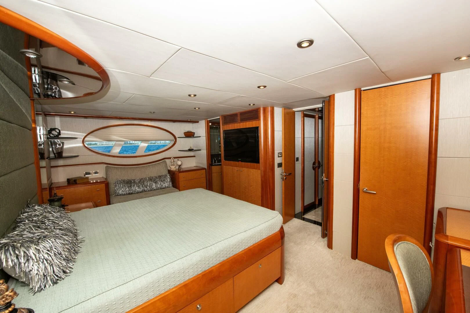 a bedroom with a large bed aboard STARFIRE Yacht for Sale