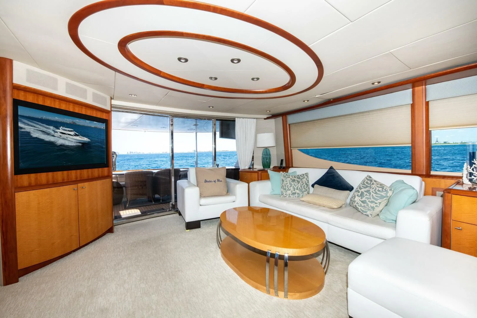 a living room with a large window aboard STARFIRE Yacht for Sale