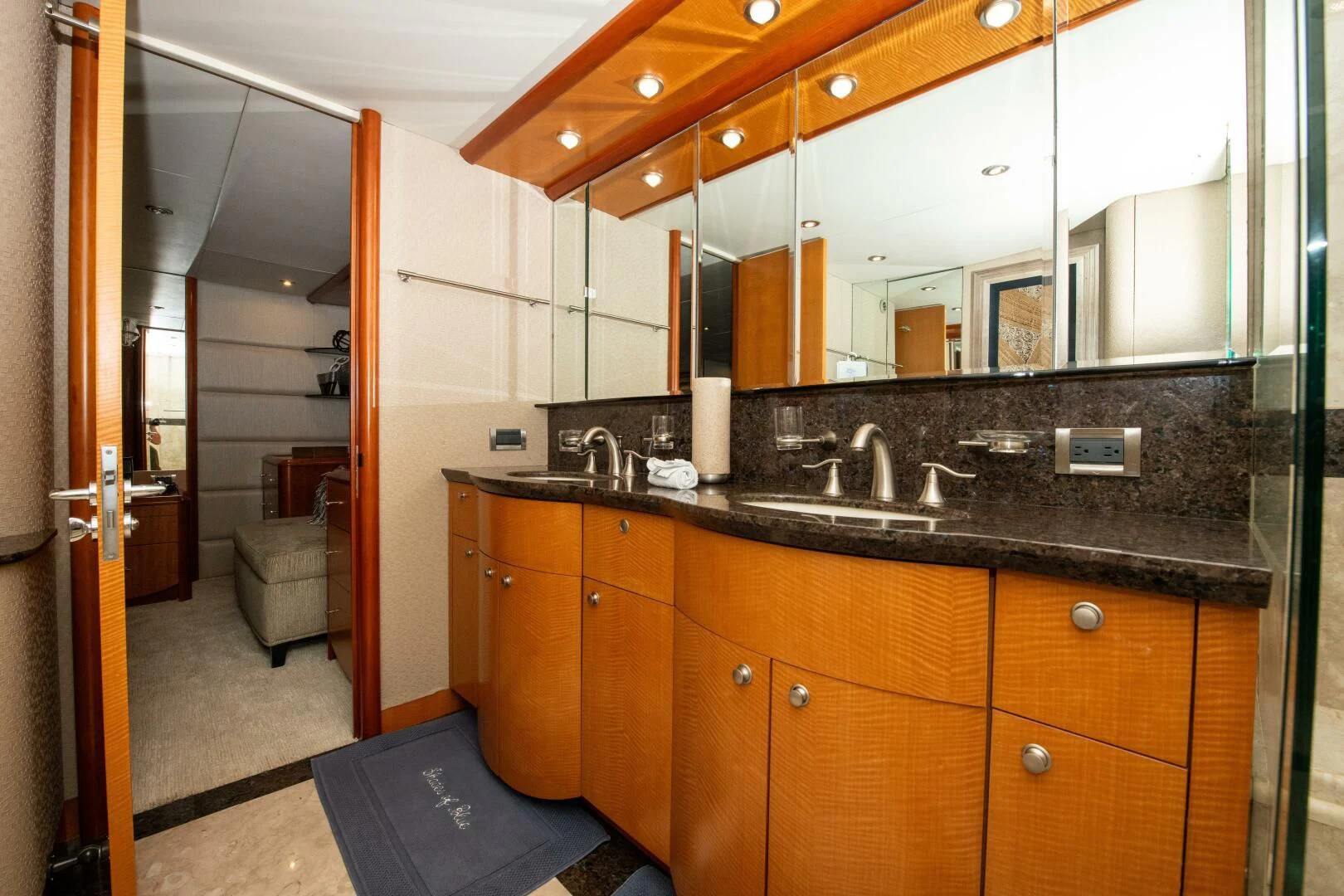 a bathroom with a large mirror aboard STARFIRE Yacht for Sale