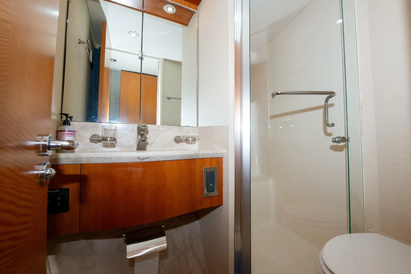 a bathroom with a sink and a mirror aboard STARFIRE Yacht for Sale