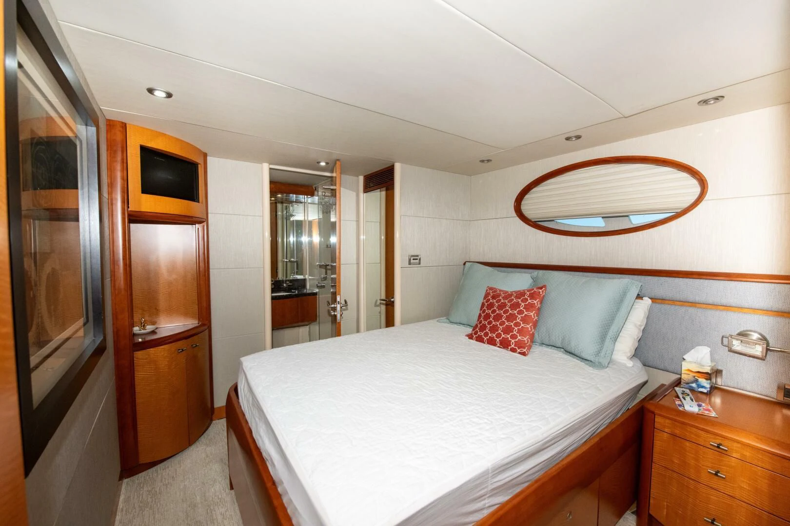 a bedroom with a large bed aboard STARFIRE Yacht for Sale