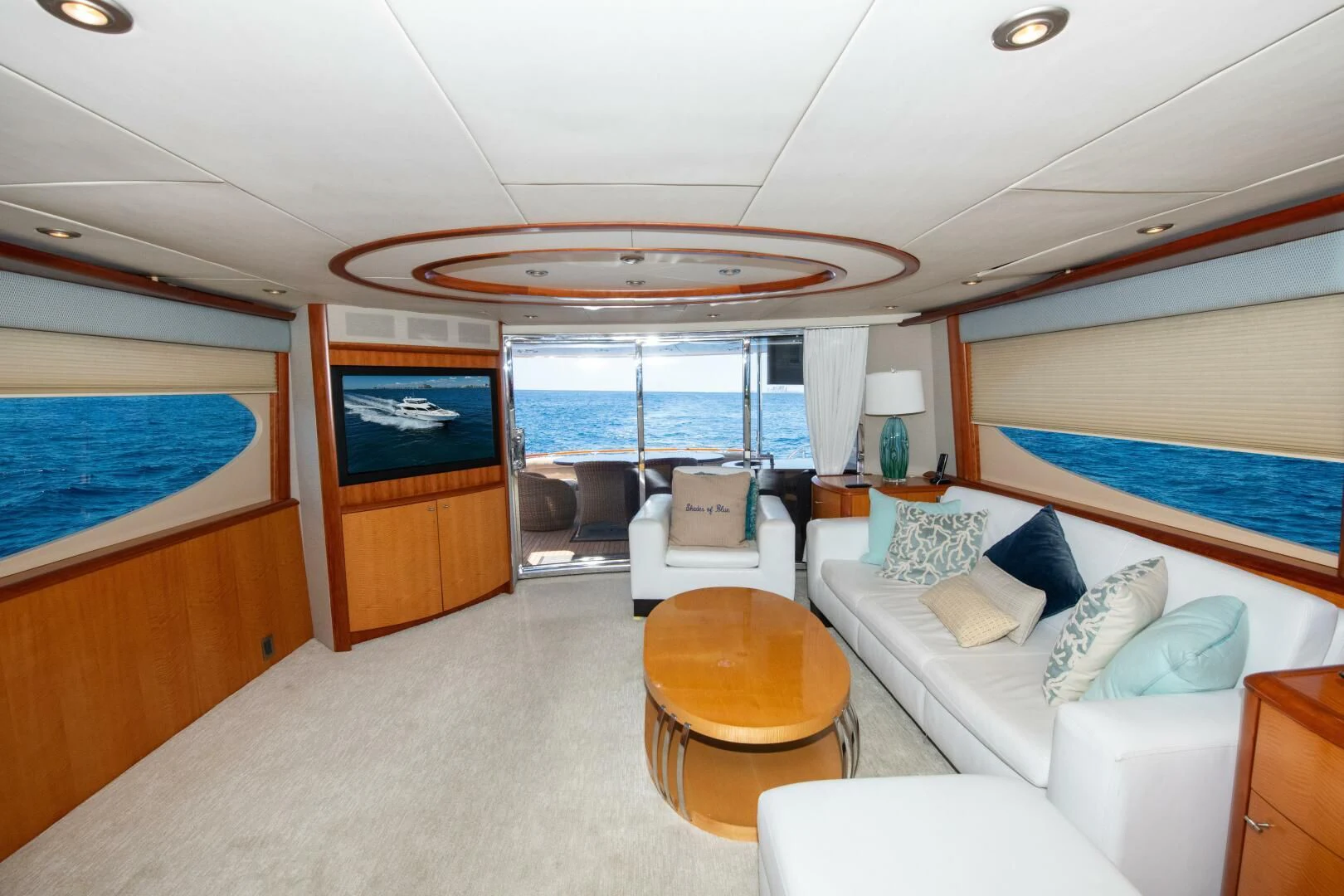 a room with a couch and a television aboard STARFIRE Yacht for Sale