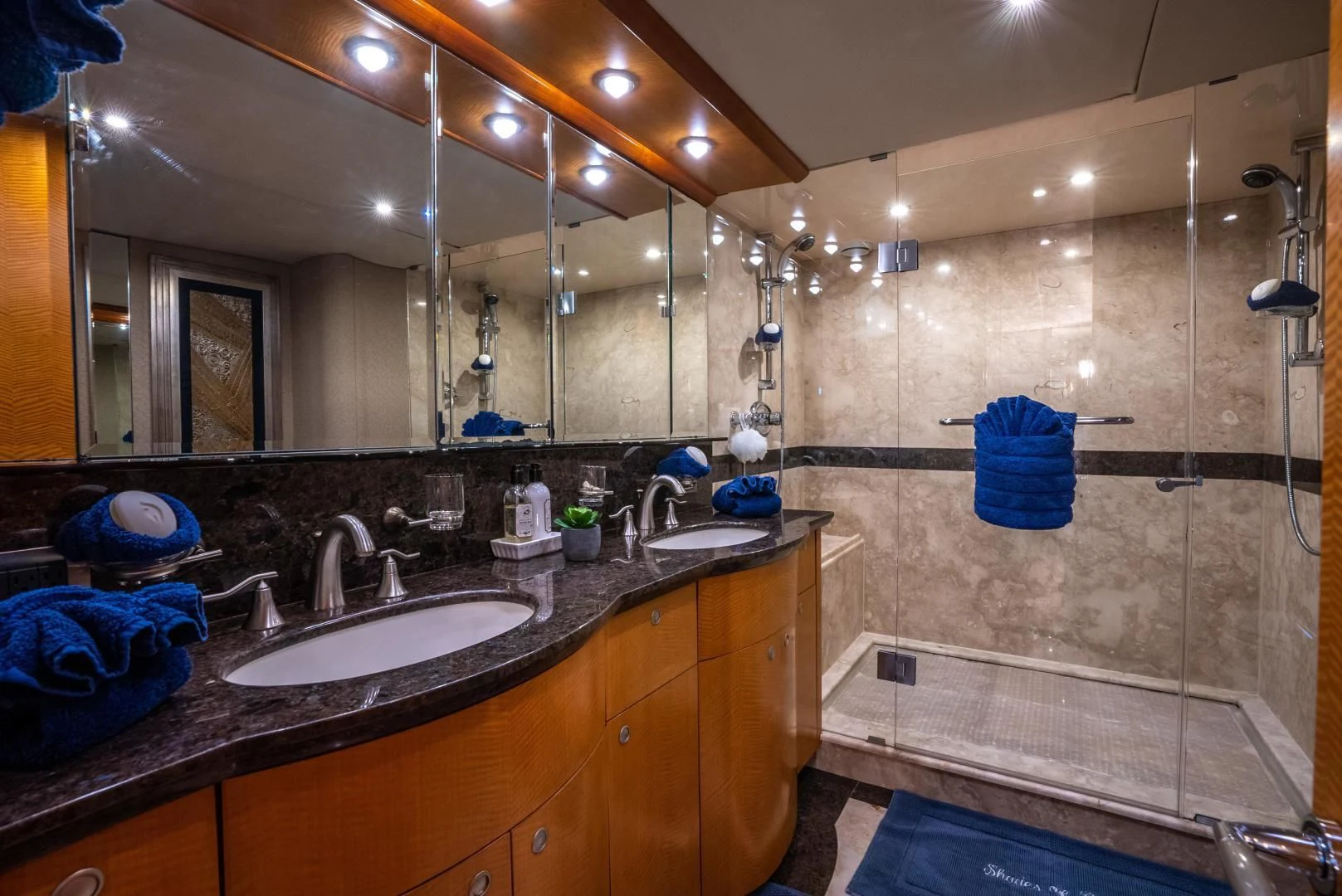 a bathroom with a large mirror aboard STARFIRE Yacht for Sale