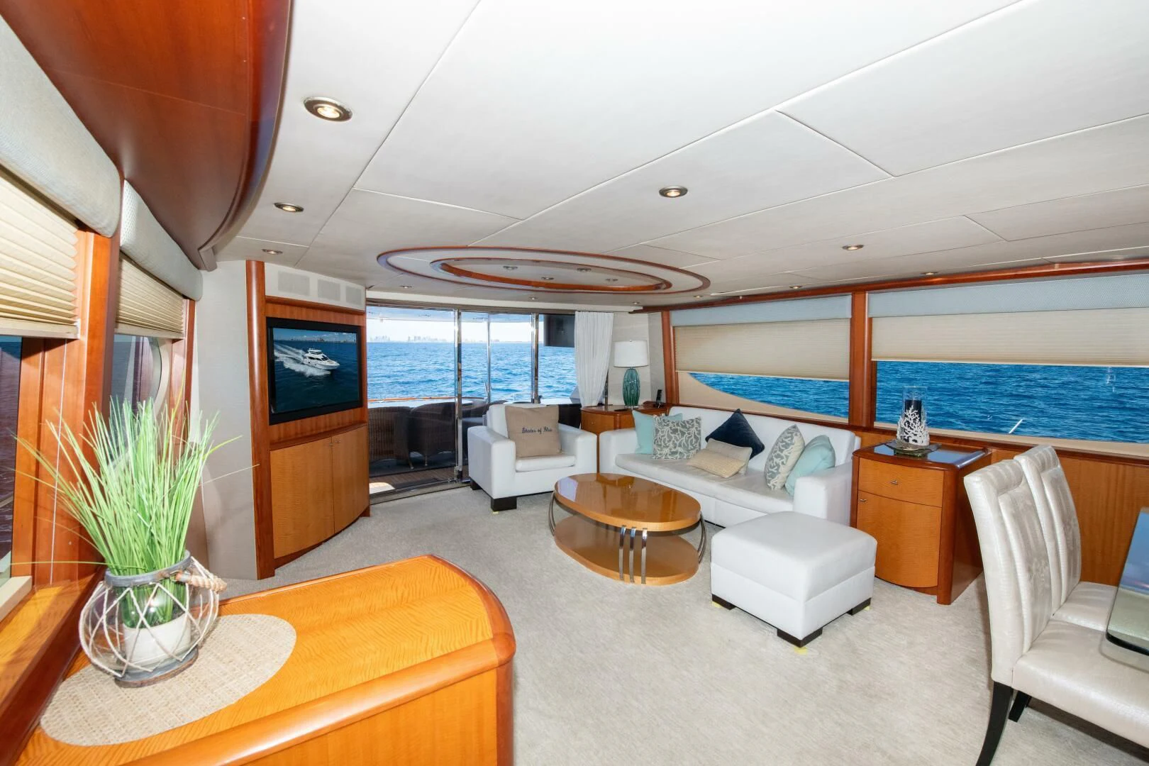 a living room with a large window aboard STARFIRE Yacht for Sale