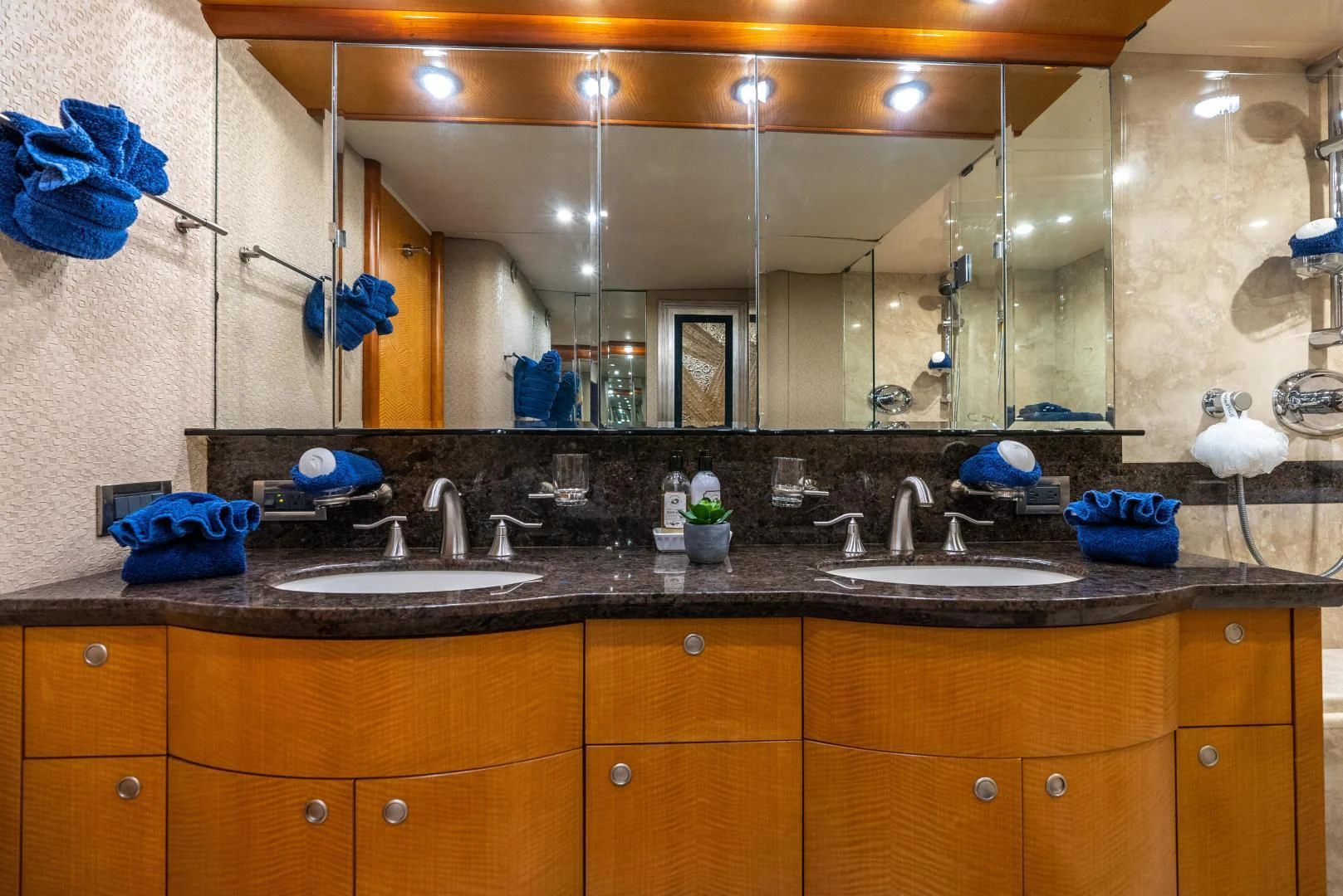 a bathroom with a large mirror aboard STARFIRE Yacht for Sale