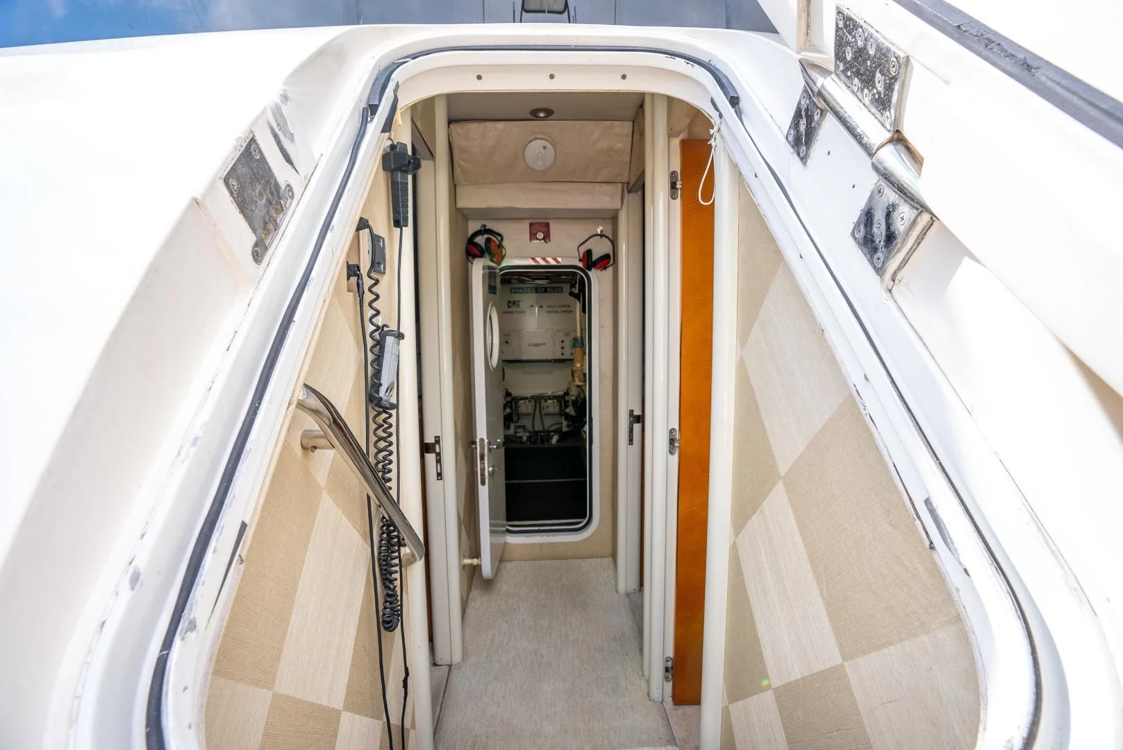 a hallway with doors aboard STARFIRE Yacht for Sale