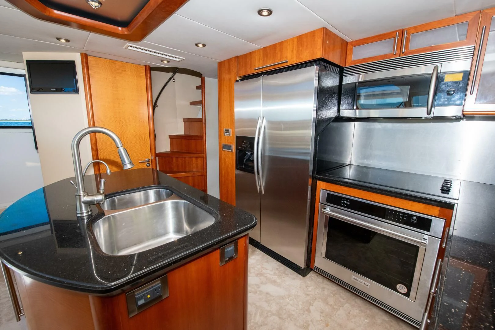 a kitchen with stainless steel appliances aboard STARFIRE Yacht for Sale