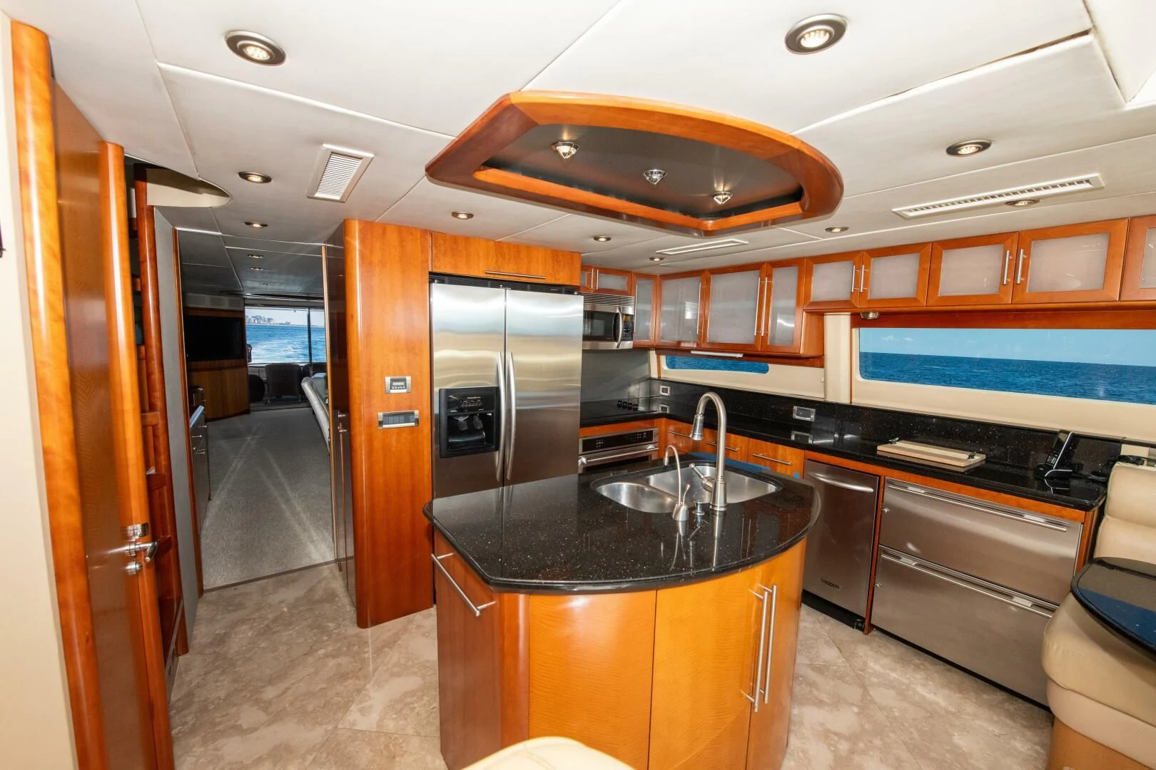 a kitchen with a black countertop aboard STARFIRE Yacht for Sale
