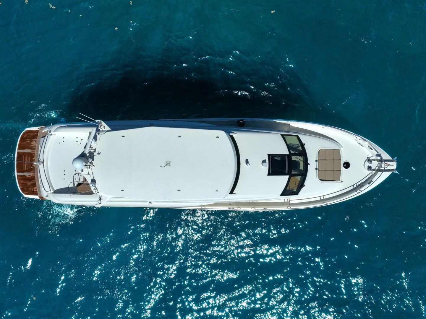 a white boat in the water aboard STARFIRE Yacht for Sale