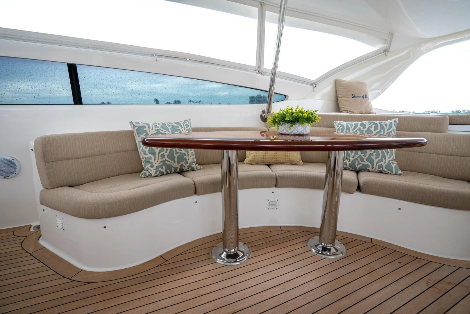 a couch and table in a room aboard STARFIRE Yacht for Sale