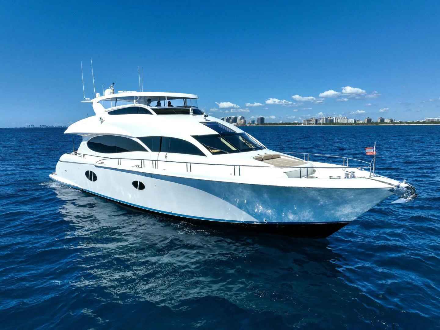 a white yacht in the water aboard STARFIRE Yacht for Sale