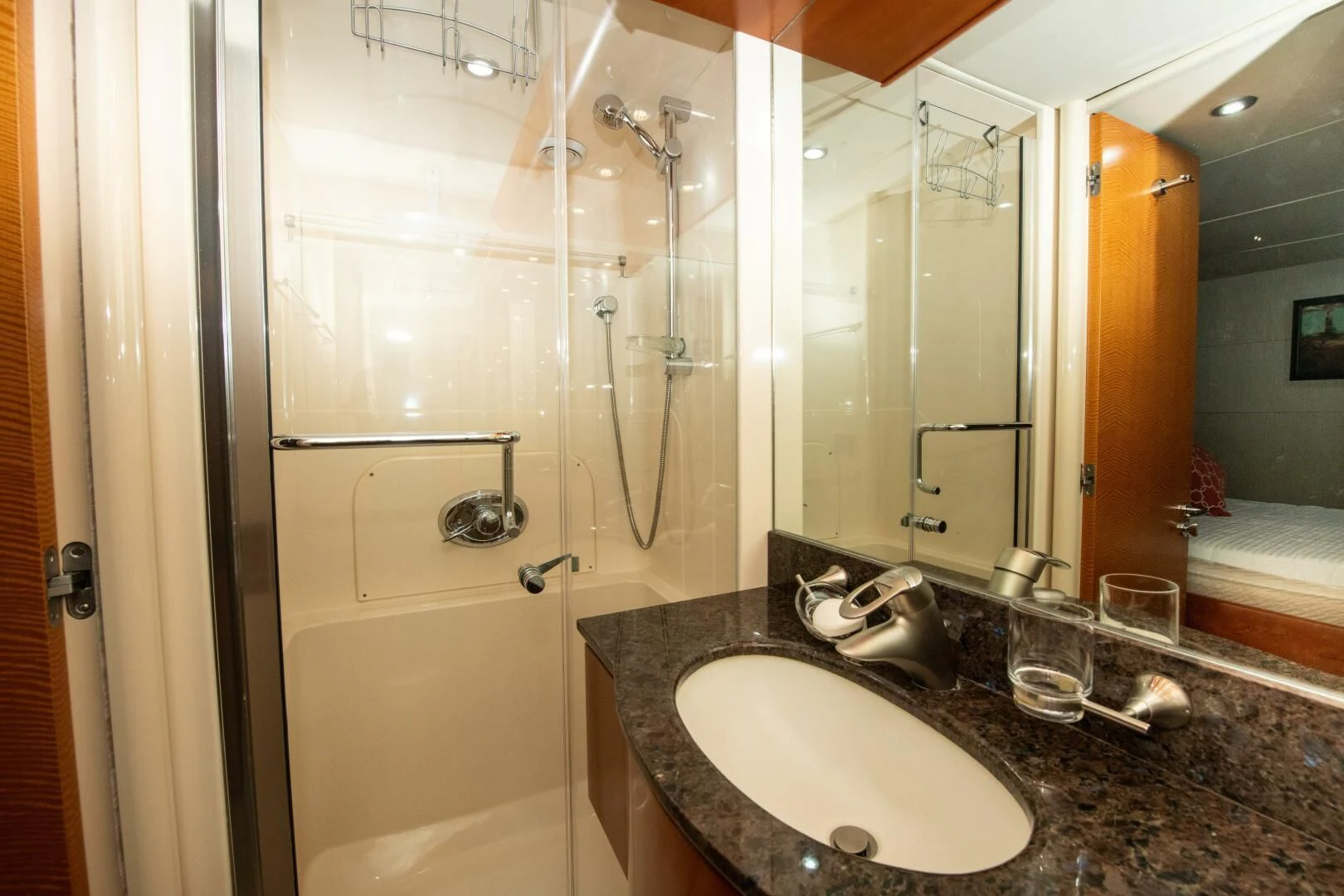 a bathroom with a sink and a shower aboard STARFIRE Yacht for Sale