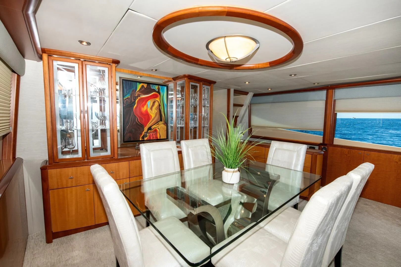a dining room with a table and chairs aboard STARFIRE Yacht for Sale